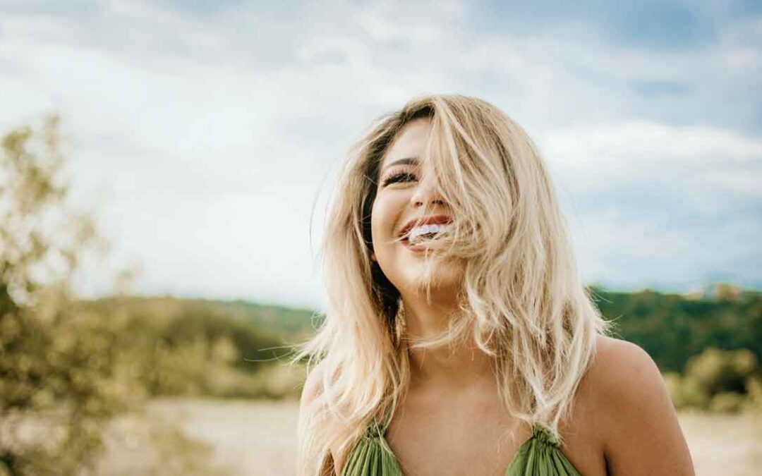 Happy woman, feeling free, enjoying nature.