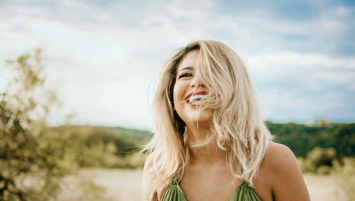 Happy woman, feeling free, enjoying nature. 